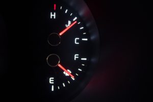 Fuel gauge indicator. Fuel efficiency is a key indicator of engine performance.
